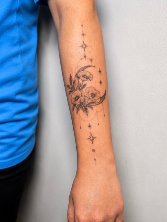 The poppies and moons piece seen down the length of the forearm